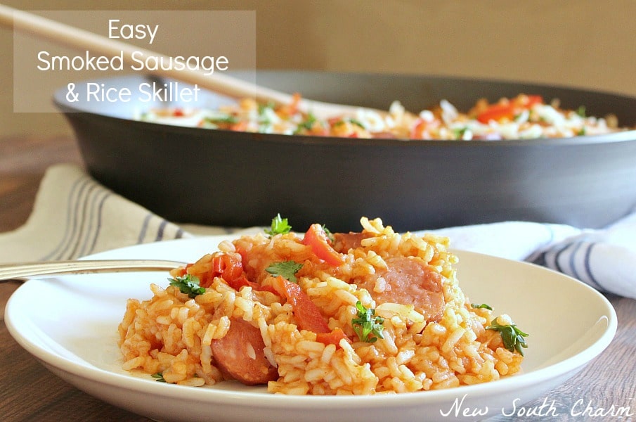 Easy Smoked Sausage and Rice Skillet in a white bowl with fork. 