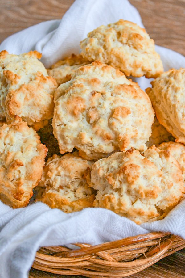 Easy Drop Biscuits in a straw basket with white tea towel