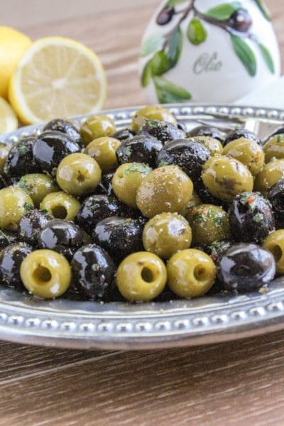 mixture of green and black marinated olives on a platter