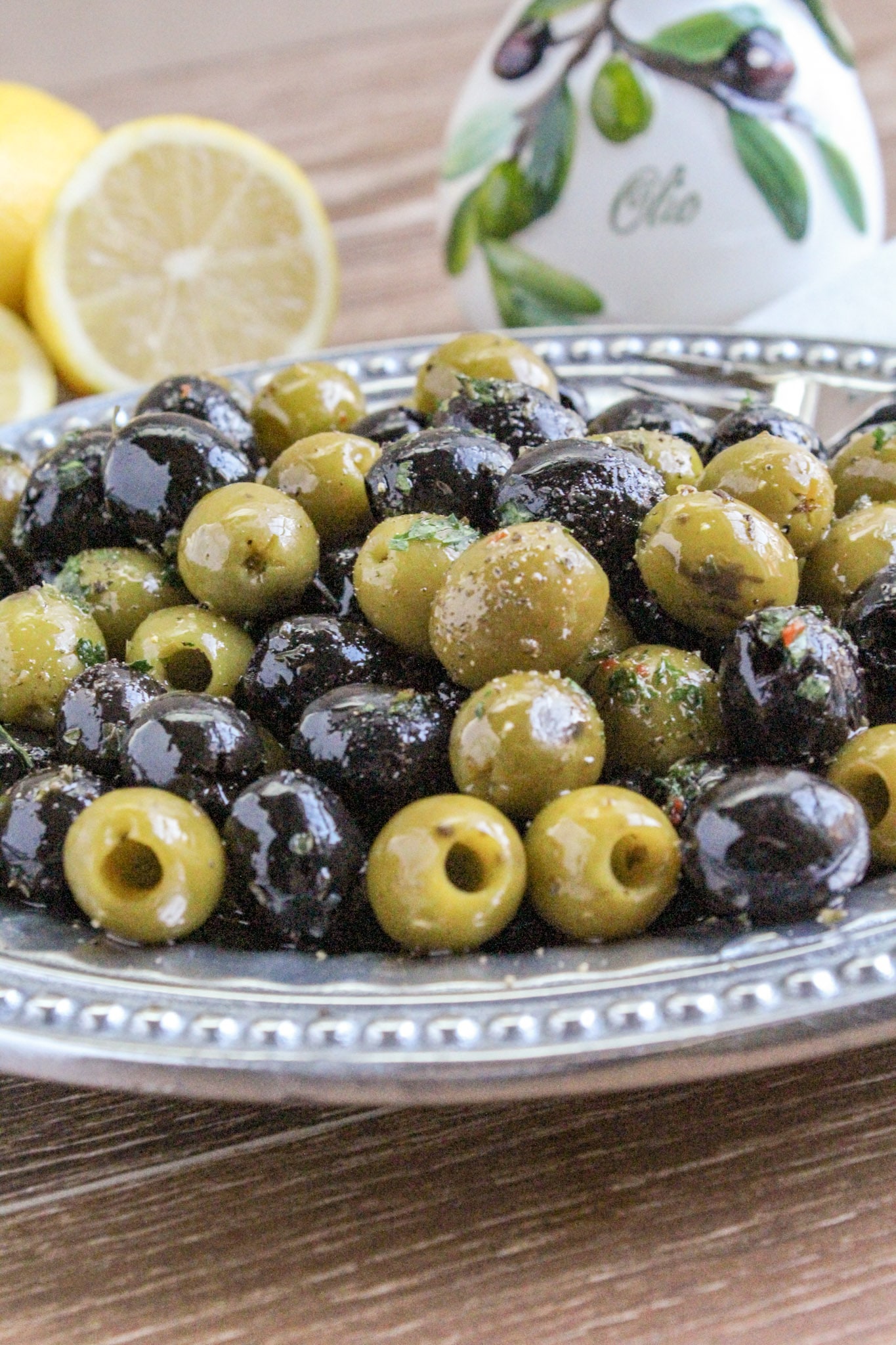 https://newsouthcharm.com/wp-content/uploads/2018/12/Garlic-and-Herb-Marinated-Olives-.jpg