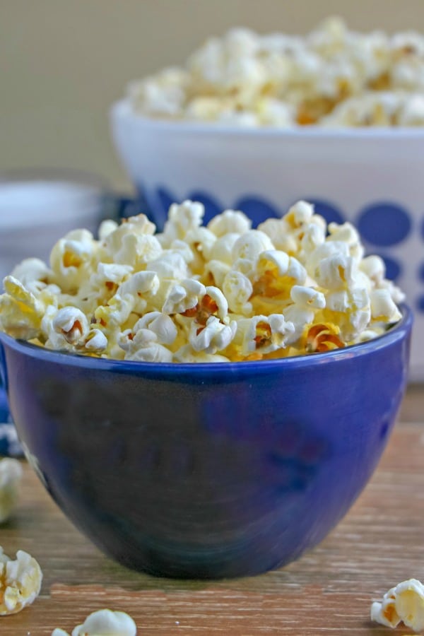 Stovetop Popcorn in individual sized blue bowl. 