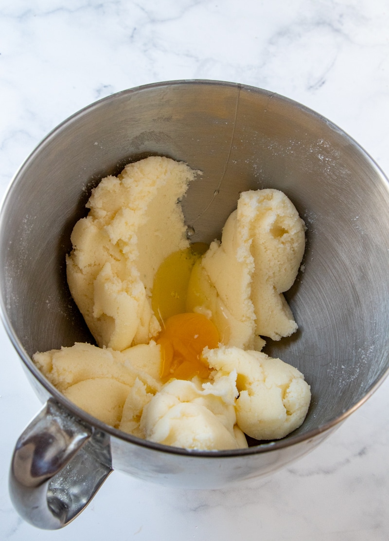 7 Up Cake step two image creamed butter and sugar with one egg yolk in a large mixing bowl 