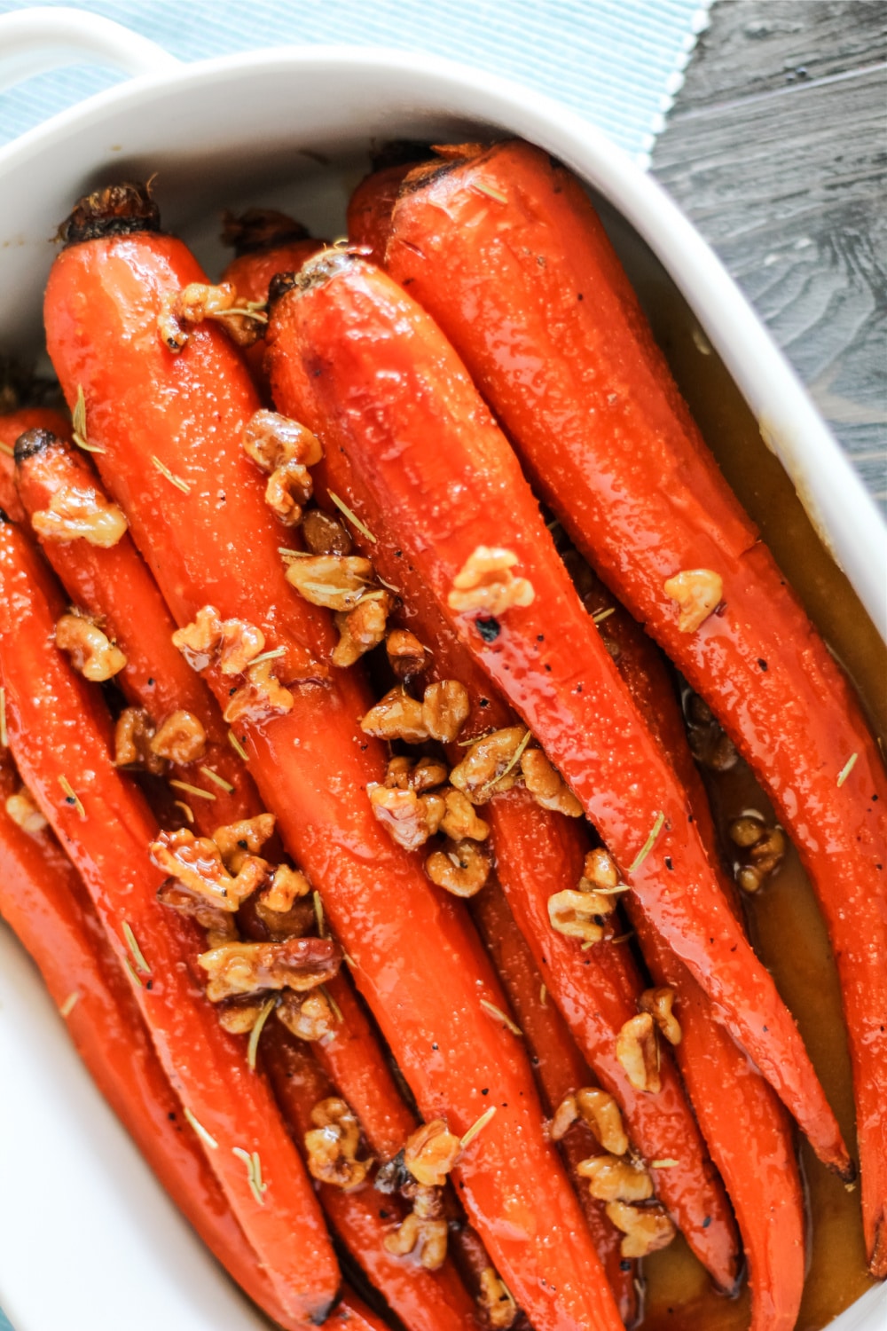 Honey and Maple Glazed i Carrots in a white serving dish. 