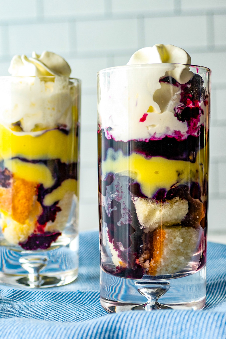 two blueberry pound cake parfaits topped with whipped cream