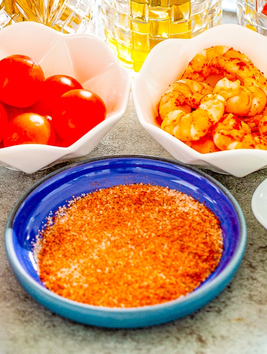 Paprika salt for the glass rim in a blue dish.