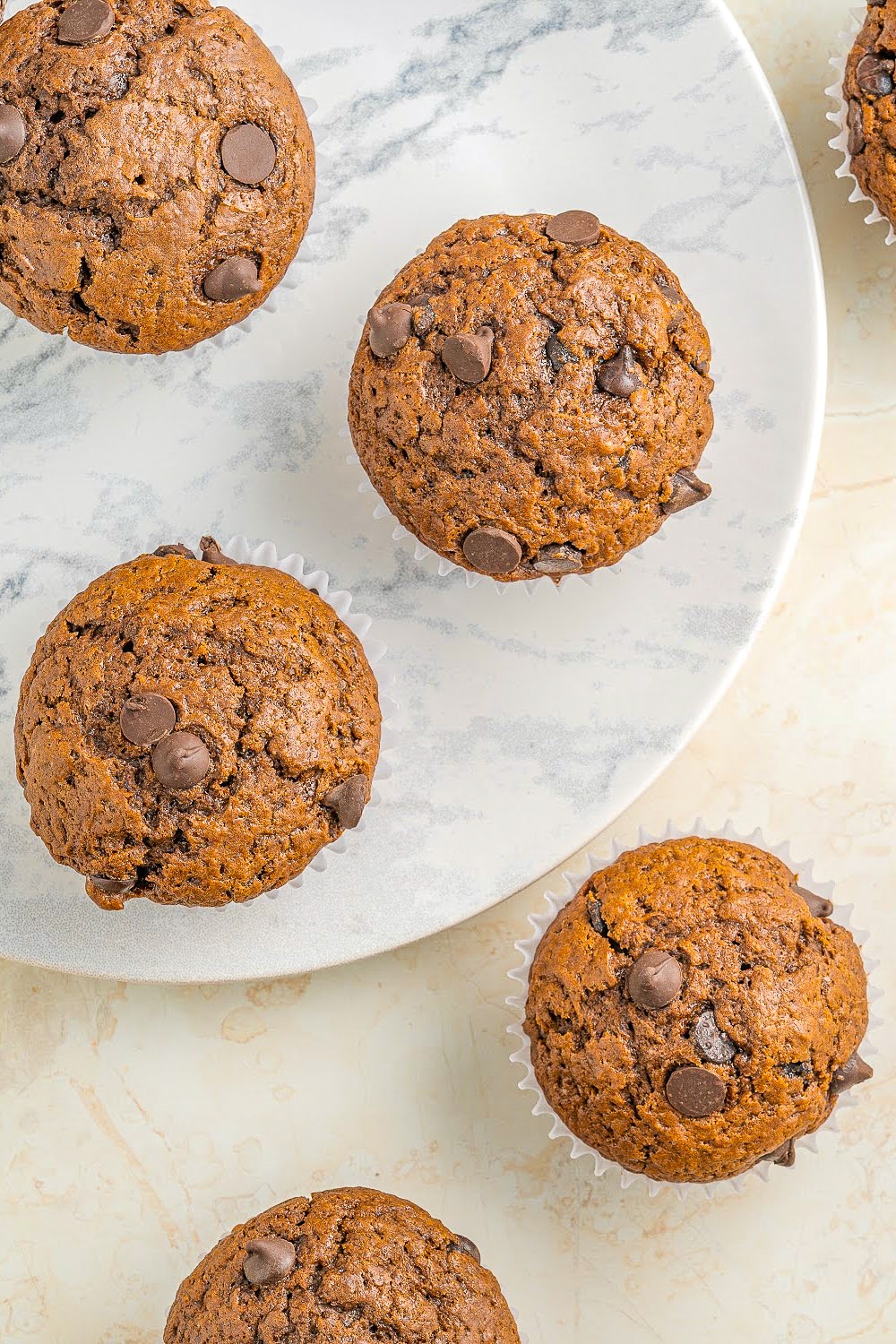 Double Chocolate Muffins on a round marble tray.