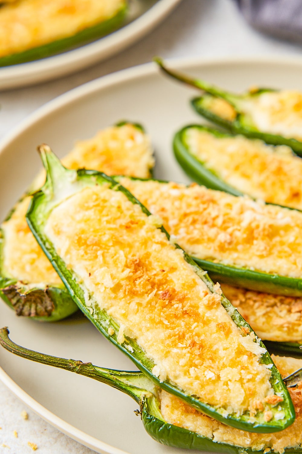 A white plate filled with Jalapeño Poppers.