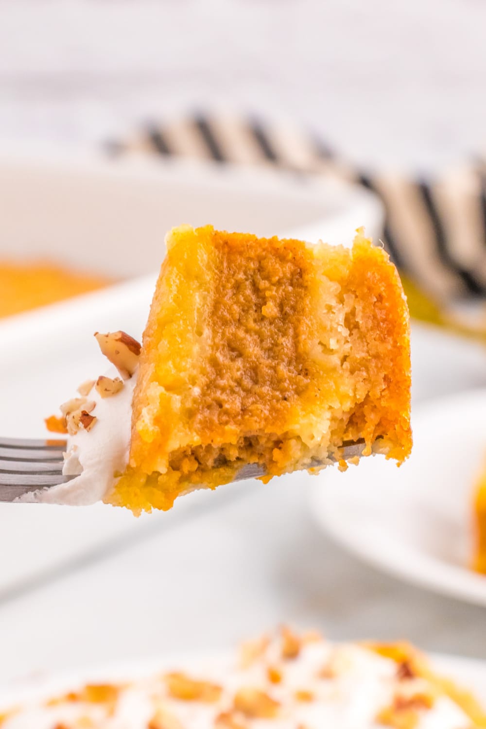 A bite of Pumpkin Pie Cake on a fork.