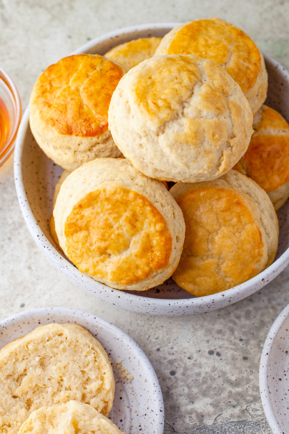 Biscuits piled high in a white bowl.