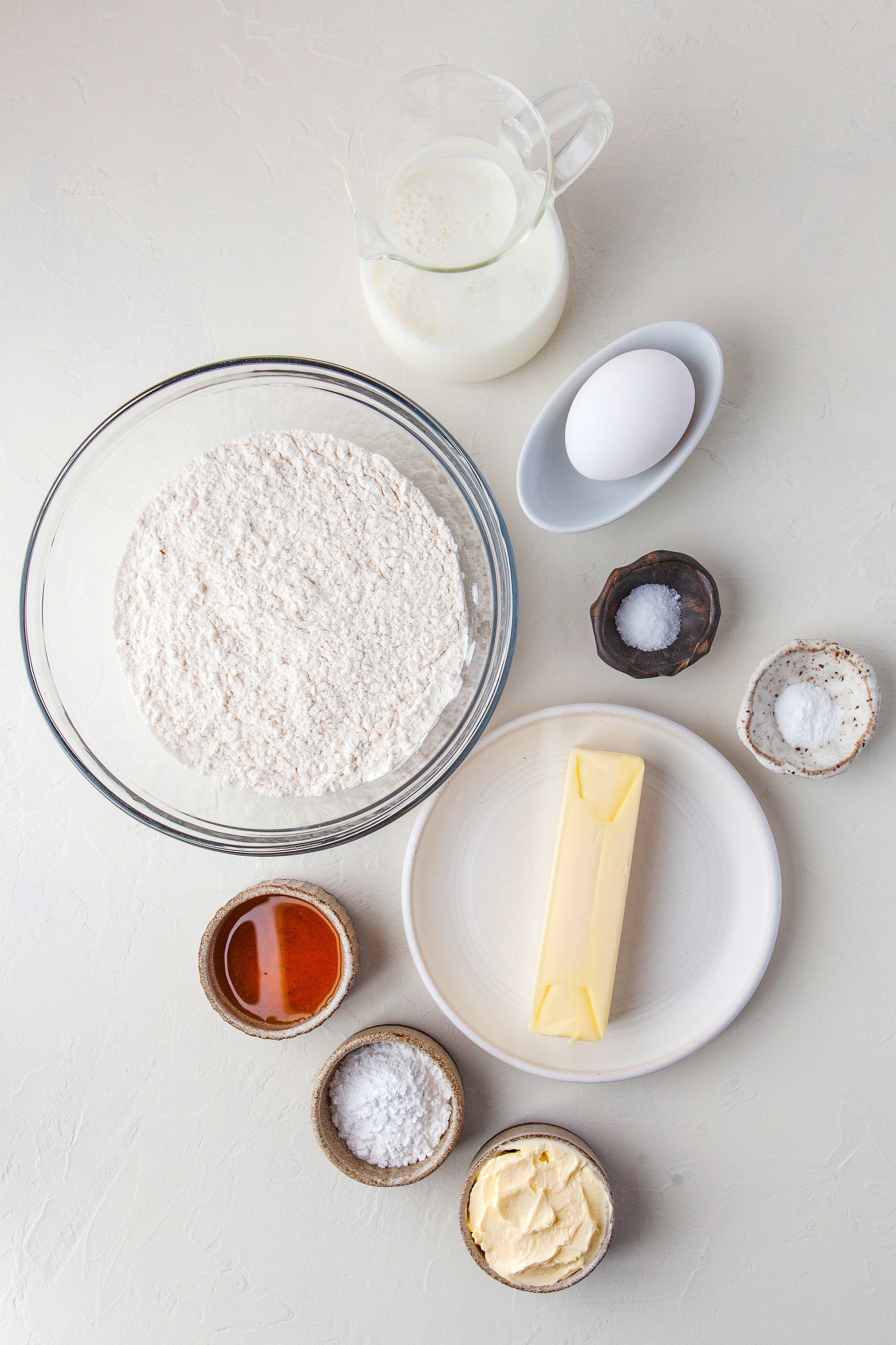 Measure ingredients needed to make this recipe presented on a white marble countertop.