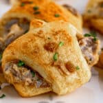 French Dip Crescent Rolls on white parchment paper.