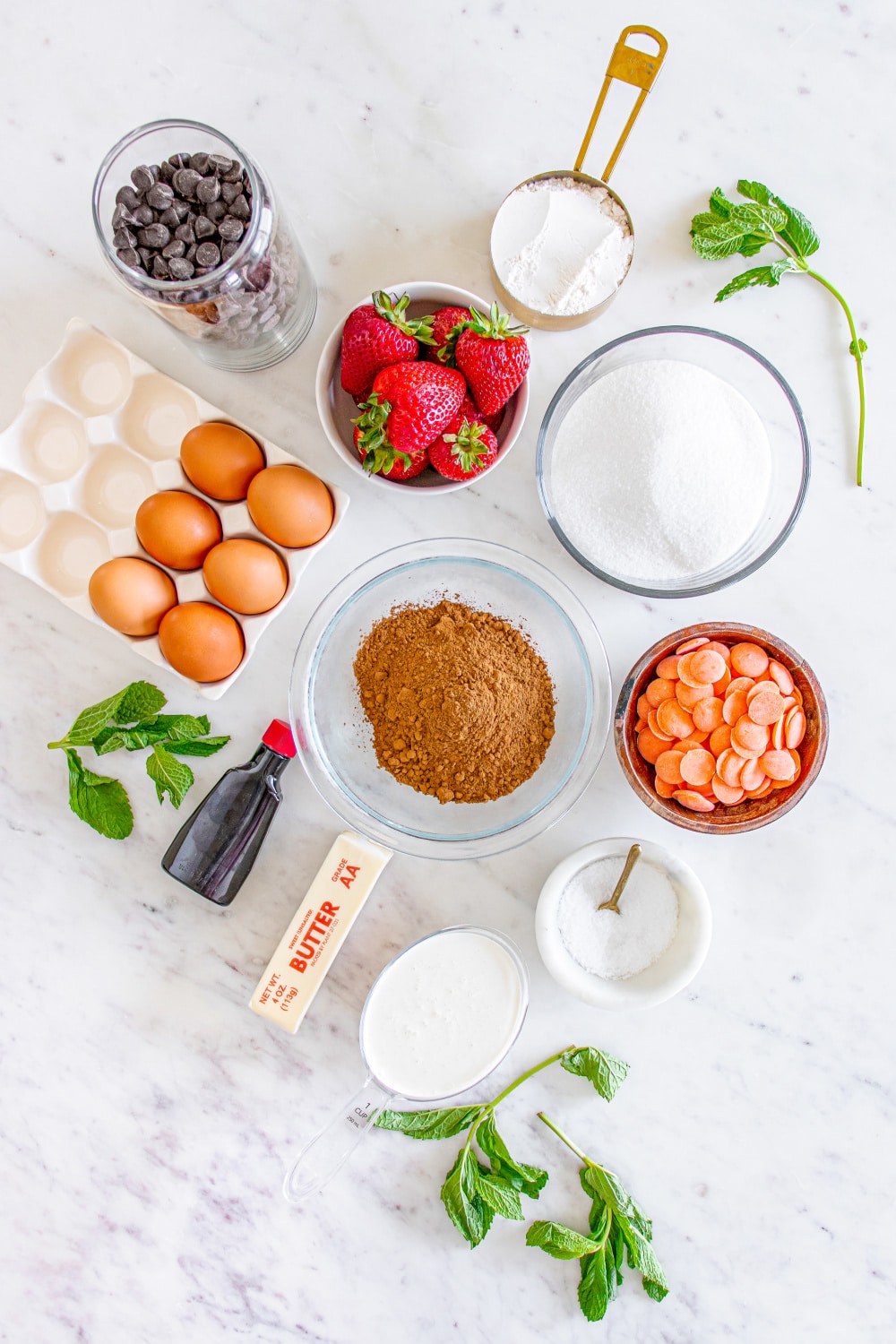 The ingredients needed to make this recipe measured and presented on a white marble countertop.