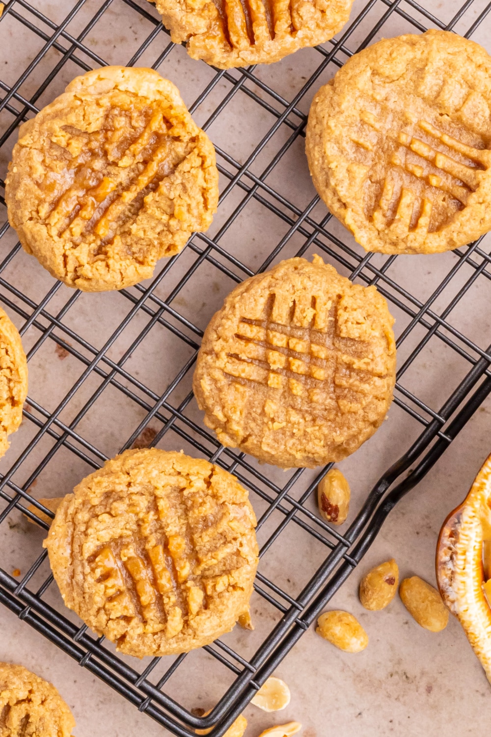 Peanut Butter Cookies fresh from the oven cooling on a rack.