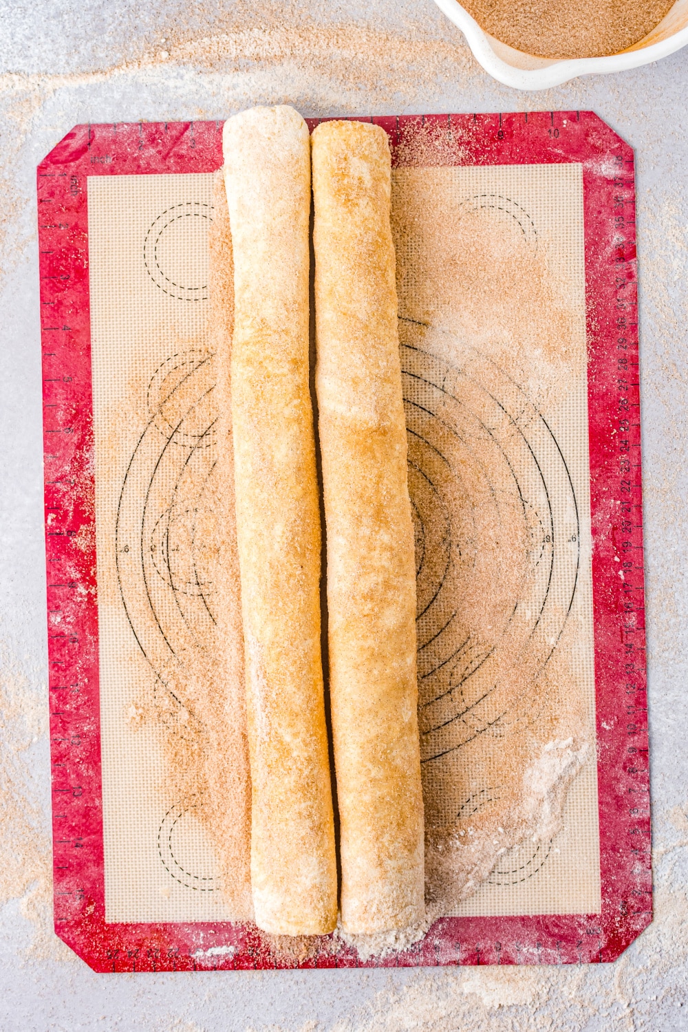 Puff pastry rolled on each side toward the middle to form the shape of the cookies.