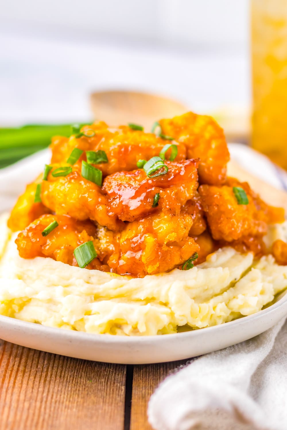 Slow Cooker Hawaiian Chicken with BBQ sauce piled high on a bed of mashed potatoes. 