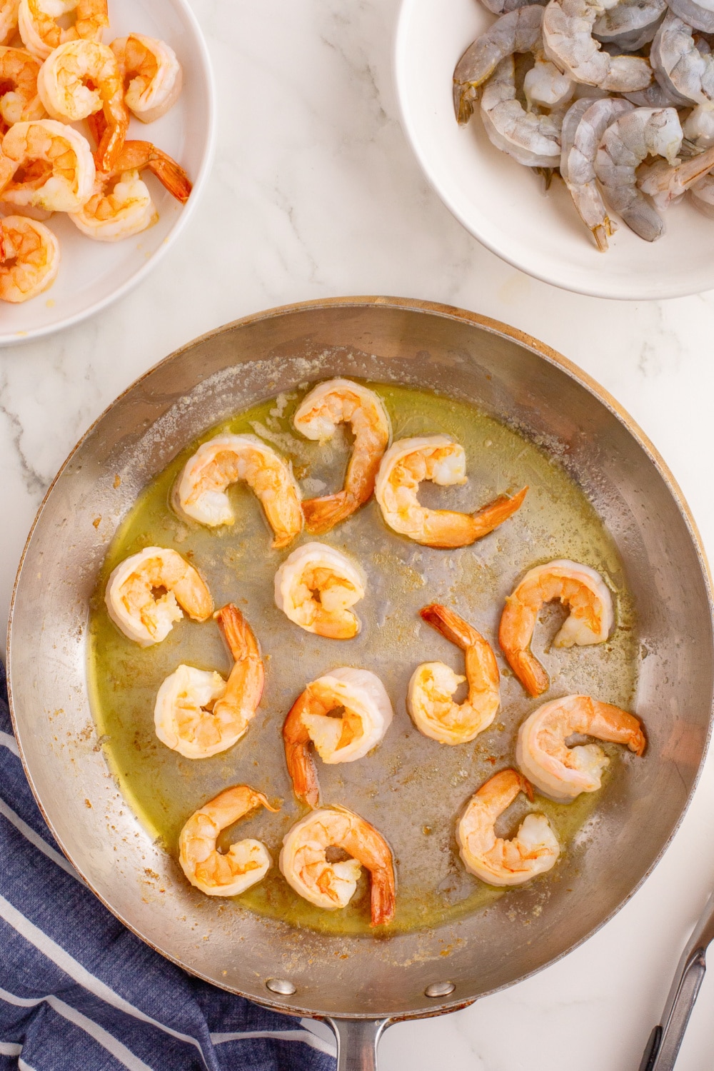 A batch of shrimp cooked in a large skillet as described in step two. 