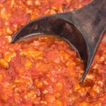 Homemade Spaghetti Sauce being scooped into a ladle.