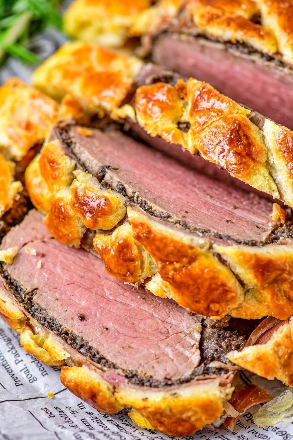 Close up image of the beef sliced inside the puff pastry crust.