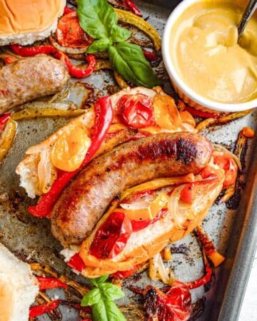 Sausage with peppers and onions on a hoagie roll.